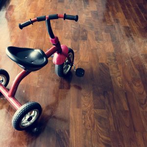 Kid bicycle on the wooden floor