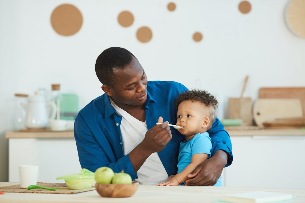 Man Feeding Son